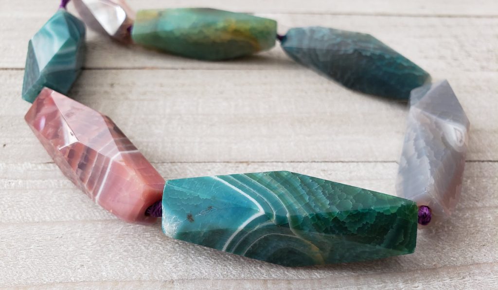 Natural stones bracelet on wooden table 