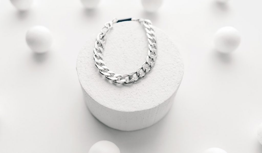 silver bijouterie chain bracelet on white background. 